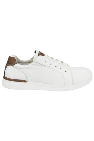 The Florsheim Kore Tour Lace Sneaker is a white low-top with textured side panels, genuine leather, white laces, and brown accents on the heel and tongue. It features a lightweight EVA sole and is shown in left side profile view.