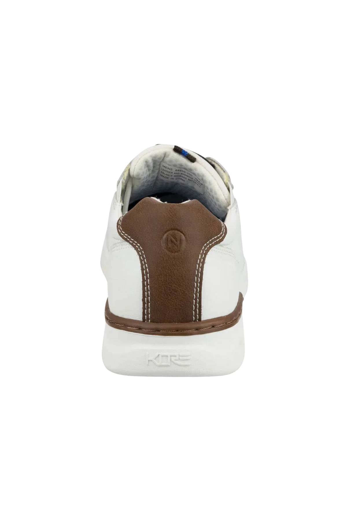 A rear view of the Florsheim Kore Tour Lace Sneaker in white, showcasing a brown genuine leather heel accent with visible stitching, an embossed "N" on the back, and "KORE" marked on its lightweight EVA sole.