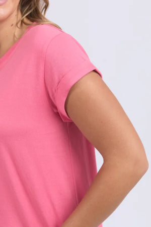 A person models the Foxwood Manly Tee, a short-sleeved cotton shirt, shown from shoulders to upper arm against a light background.