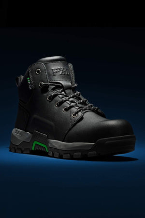 Introducing the FXD WB-3 Work Boot: a black, rugged hiking boot crafted from premium leather, featuring a sturdy sole and reinforced safety toe. Set against a dark background, this boot is designed for outdoor activities with its green accents and visible laces.