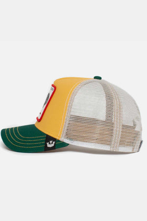 The Goorin Bros The Cock Cap features a side view with a green visor, yellow front panel, and white mesh back. It includes a front red-bordered patch and a small black label on the side of the visor.