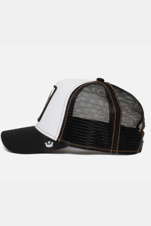 Side view of the Goorin Bros The King Lion Cap with a black bill, white front panel, and black mesh back. The cap features a small crown logo on the side near the adjustable strap and has contrast stitching.