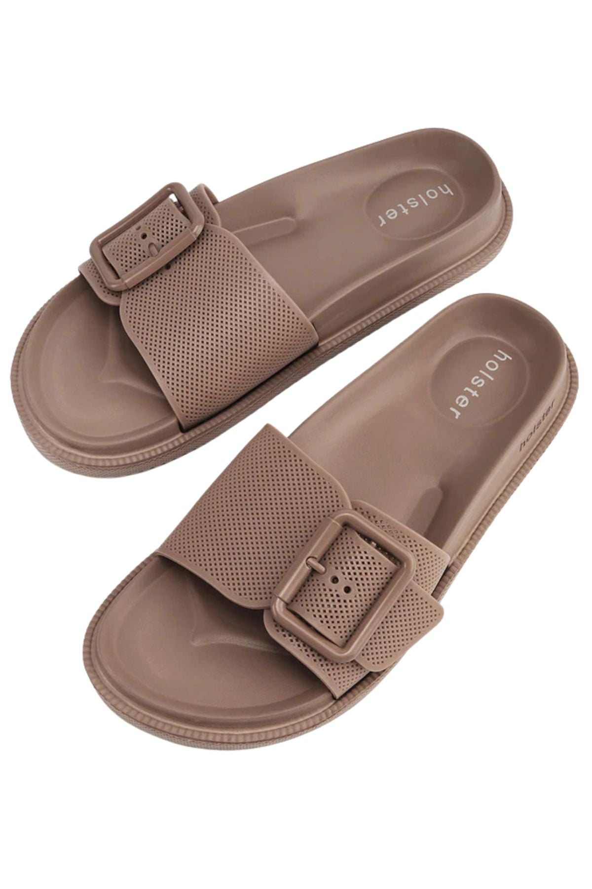 A pair of Holster Laze light brown vegan sandals featuring textured, perforated straps and large rectangular buckles, displayed on a white background. "honeyer" is printed on the footbed.
