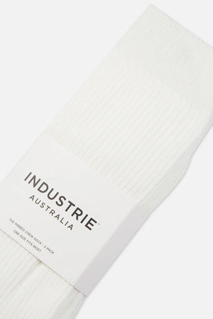 A close-up of comfortable white ribbed Industrie Crew Sock 2pk, packaged with a white label reading "INDUSTRIE AUSTRALIA – The Ribbed Crew Sock, 2 Pack, One Size Fits Most.