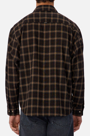 A person is shown from the back wearing the Industrie The Carrington Shirt, a regular fit, long-sleeve dark brown and black checked shirt, paired with dark denim jeans.