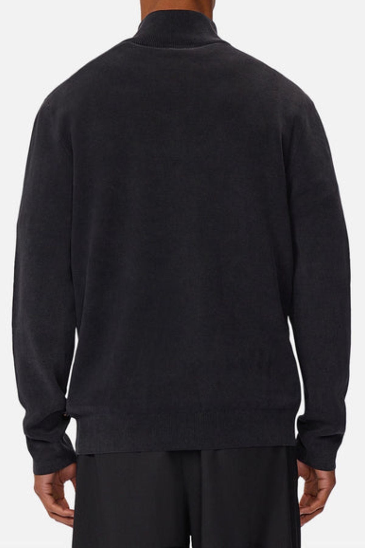 A person is shown from the back wearing Industrie The Lakewood Zip Neck, a plain, long-sleeved black cotton jumper with black pants. The relaxed, regular-fit outfit is set against a white background.