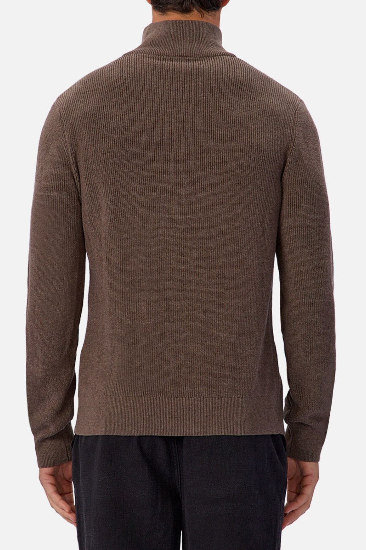A person is seen from behind, wearing the Industrie The New England Zip Neck Knit in brown with dark pants, standing against a plain light background.