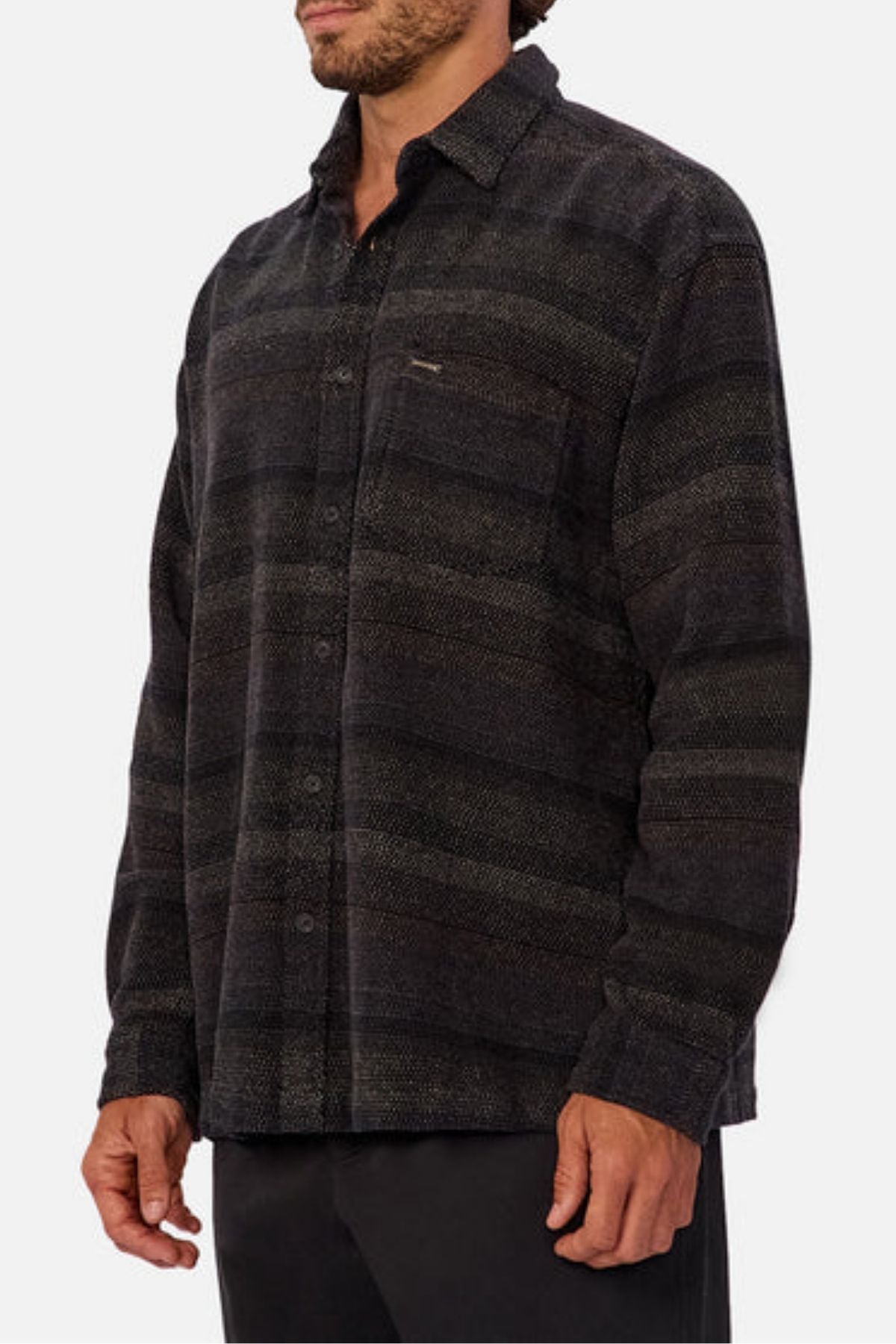 A man models the Industrie The Sonoran Long Sleeve Shirt, showcasing its regular fit, subtle horizontal stripes, and single chest pocket against a plain light background.