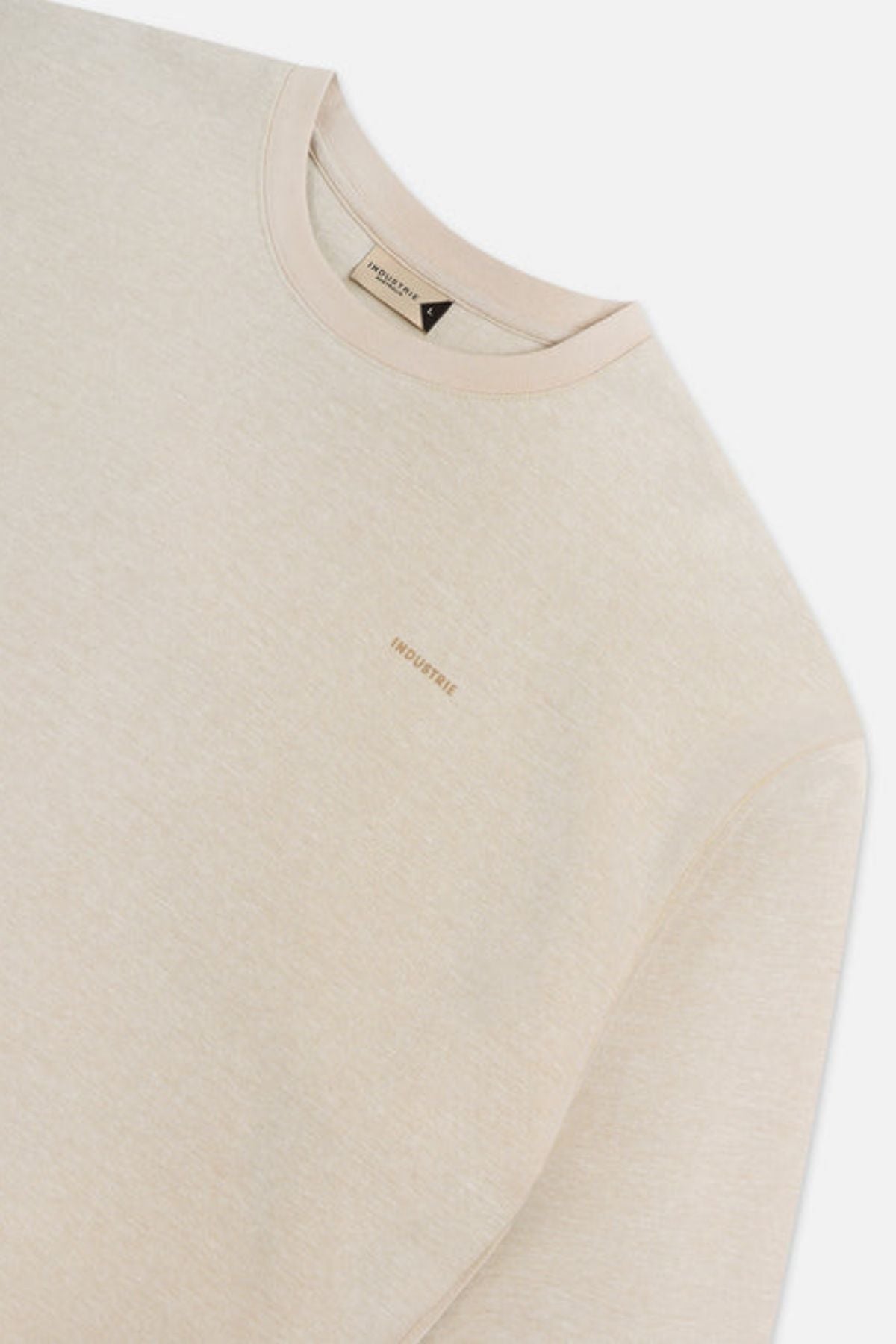 The Tech Del Sur Sweat by Industrie is a beige crewneck sweatshirt with a subtle embroidered "INDUSTRIE" logo on the chest, made from breathable fabric for all-day comfort, shown against a plain white background.