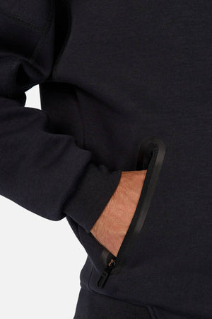Wearing the Industrie The Washington Zip Thru, a person places their right hand in a slightly open black zippered pocket—making it ideal for everyday wear.