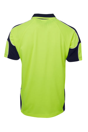 The JBs Hi Vis Arm Panel Polo is a short-sleeve shirt with a bright yellow-green back, dark blue collar and side panels, white shoulder/sleeve accents, and reflective piping for visibility. Shown flat from the back.