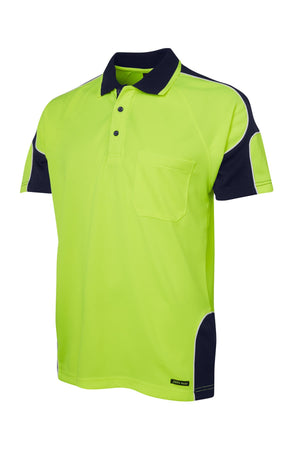 The JBs Hi Vis Arm Panel Polo is a short-sleeved, yellow-green polo shirt with navy accents on the collar, sleeves, and sides. It features reflective piping for visibility, a chest pocket, and a three-button collar.