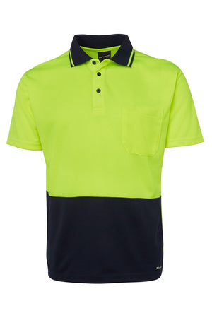 The JBs Hi Vis Non Cuff Traditional Polo is a short-sleeved 100% polyester shirt featuring a bright yellow-green upper, solid black lower half, chest pocket, and black collar and button trim.