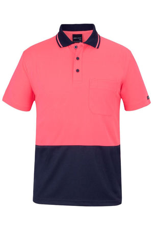 The JBs Hi Vis Non Cuff Traditional Polo is a stylish short-sleeve shirt with a bright pink upper half, navy blue lower half, left chest pocket, collar with three buttons, and is made from 100% polyester for comfort and durability.