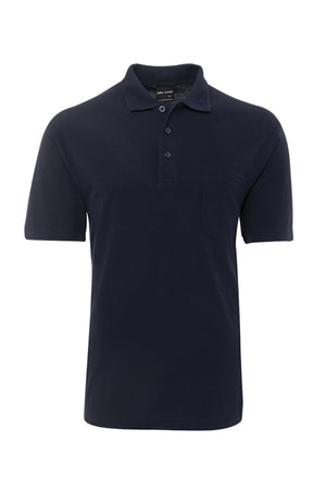The JBs Pocket Polo is a plain, regular fit polo in dark navy blue featuring short sleeves, a collar, three-button placket, and chest pocket, shown on a white background.