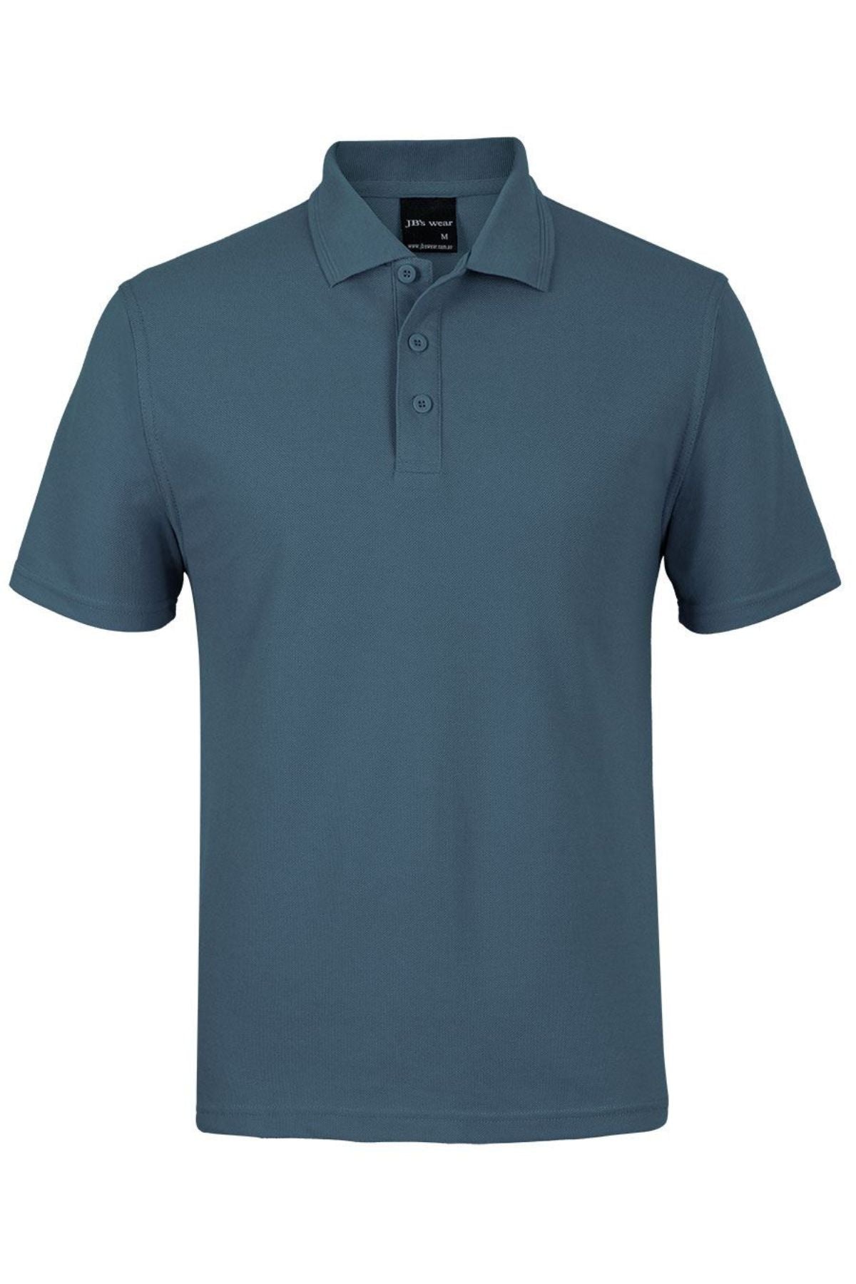 The JBs Short Sleeve Polo is a teal shirt with UPF protection, featuring short sleeves, a collar, and three buttons down the front. Displayed on a white background.