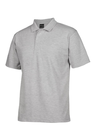 The JBs Short Sleeve Polo, shown in plain light gray with a collar and three buttons on a white background, is durable and UPF compliant for added sun protection.