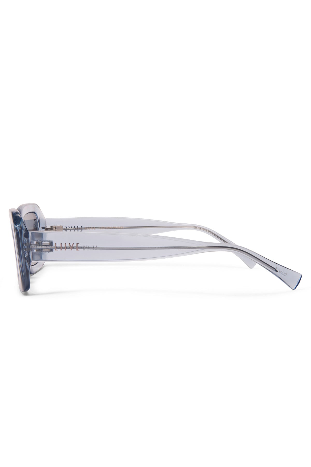 Side view of translucent light blue Liive Crush Sunglasses with square frames and slim arms on a white background—a vintage 90s-inspired look combined with modern UV protection.
