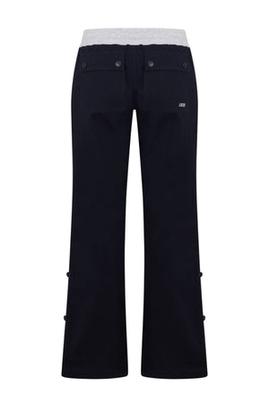 Rear view of the Lorna Jane Flashdance Work Pant in black, featuring two buttoned back pockets and a light gray waistband.