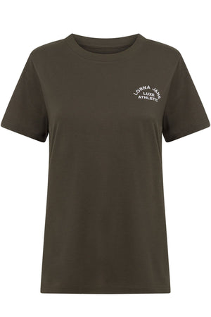 The Lorna Jane Lotus T-Shirt is a dark olive green women's crew neck with short sleeves and a small white "Lorna Jane Luxe Athletic" logo on the left chest. Ideal for an active lifestyle and everyday comfort.