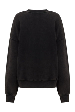 The Lorna Jane New Sport Washed Sweatshirt is shown from the back in plain black, featuring a crew neck, dropped shoulders, ribbed cuffs and hem, and a vintage-inspired oversized fit.