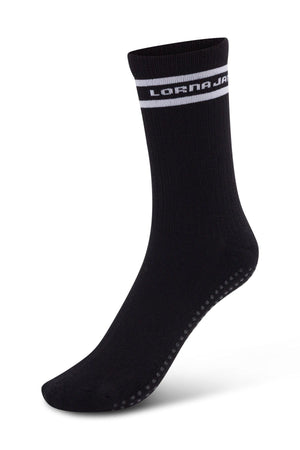 Lorna Jane Pilates Grip Crew Socks in black, featuring white "LAFMAJAR" text and a stripe at the top, ribbed texture, and small non-slip grips on the sole—ideal for Pilates—displayed on a plain white background.