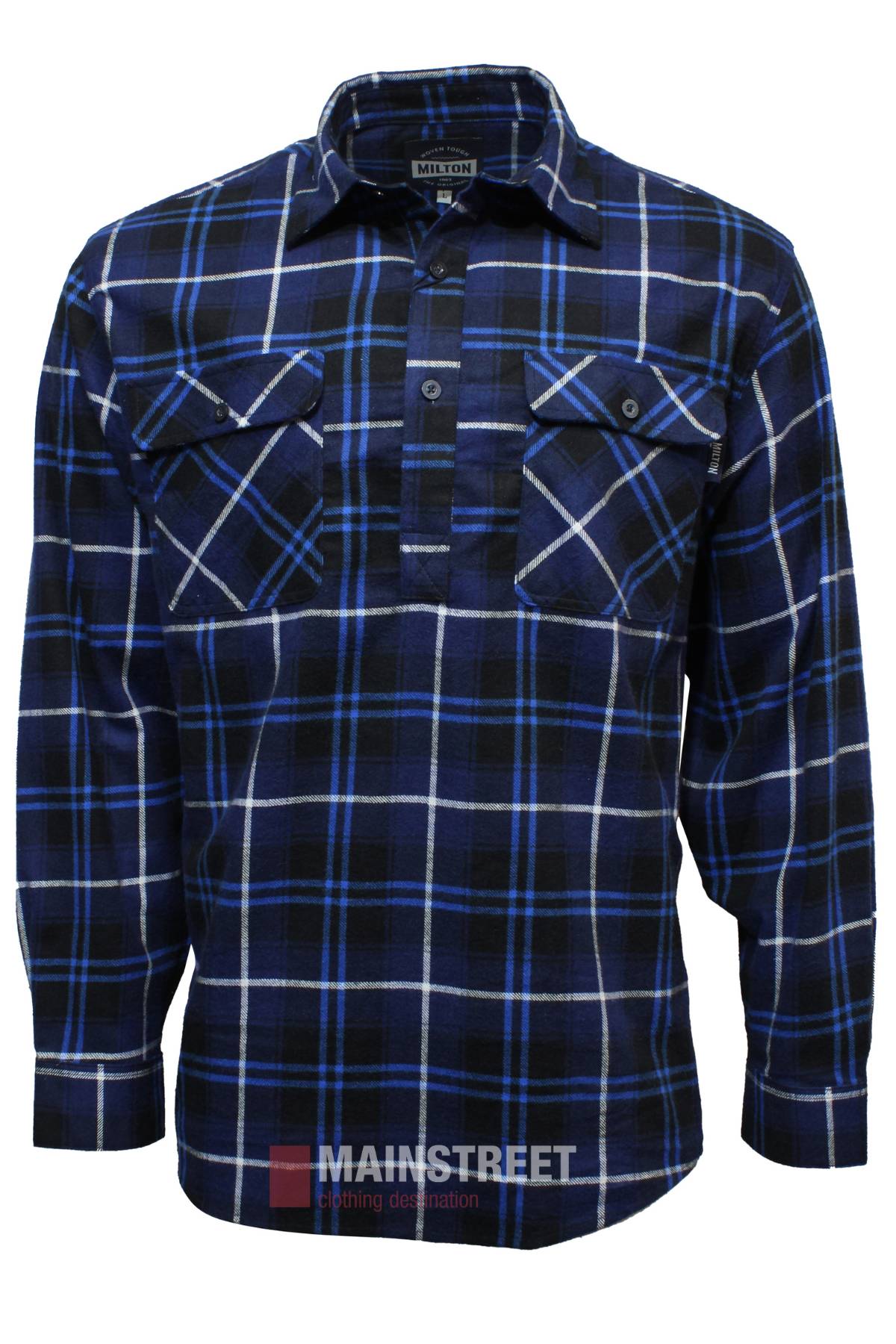 The Milton Closed Front Flannelette Shirt is a long-sleeve blue, black, and white cotton shirt with a collar, button-down chest pocket flaps, and "Mainstreet" branding. Shown buttoned halfway on a plain white background.