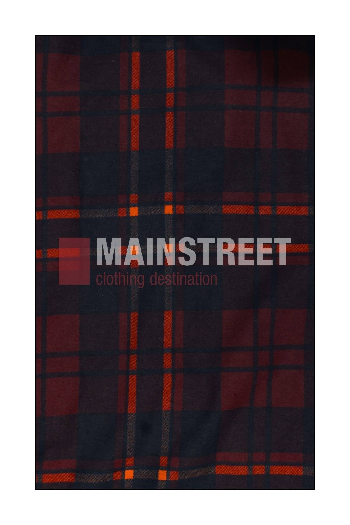 The background features a dark plaid fabric with red and orange stripes, inspired by the Milton Open Front Flannelette Shirt. "MAINSTREET clothing destination" is centered in bold white and gray letters across the fabric.
