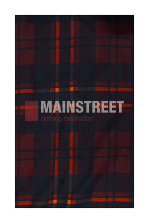 The background features a dark plaid fabric with red and orange stripes, inspired by the Milton Open Front Flannelette Shirt. "MAINSTREET clothing destination" is centered in bold white and gray letters across the fabric.