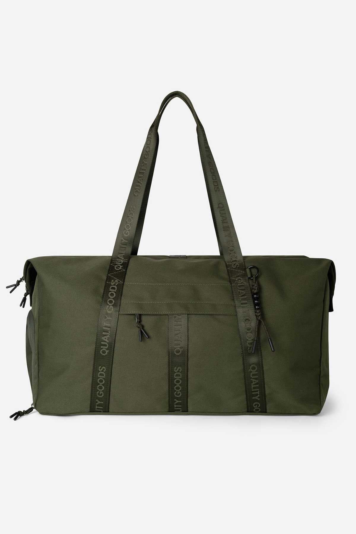 Introducing the Mr Simple Nelson Duffle, a spacious olive green bag with black zippers and handles. The sturdy handles feature "QUALITY GOODS" in bold black print. It includes a front zippered pocket and two side pockets for ample storage of your essentials.