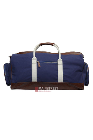 The Pilbara Long Weekender Bag features a blue canvas body, white straps, brown leather handles, and brown accents on the sides and bottom—a stylish choice for short trips, displayed against a white background.