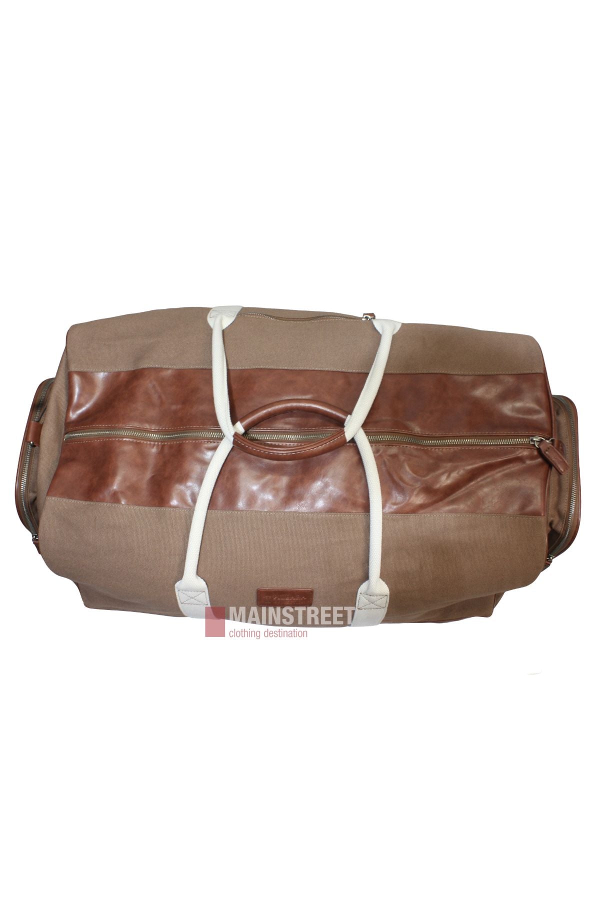The Pilbara Long Weekender Bag features brown canvas, leather accents, white handles, a horizontal leather strip, a zipper pocket, and the "MAINSTREET clothing destination" logo—perfect for your next getaway.