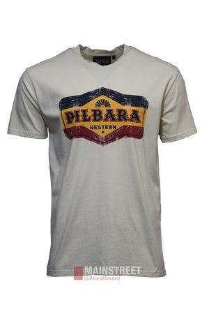 The Pilbara Oil Can T-Shirt is cream-colored with a vintage "PILBARA WESTERN" graphic in navy, red, and yellow on the chest. Its relaxed fit is shown against a plain white background.