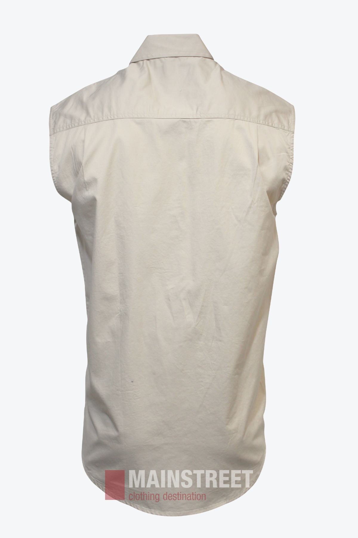 Back view of a sleeveless, light beige Pilbara Sleeveless Closed Front Shirt on a plain white background. Made from 100% cotton, this work shirt features a shoulder yoke, slight wrinkling, and the "MAINSTREET" logo at the hem.