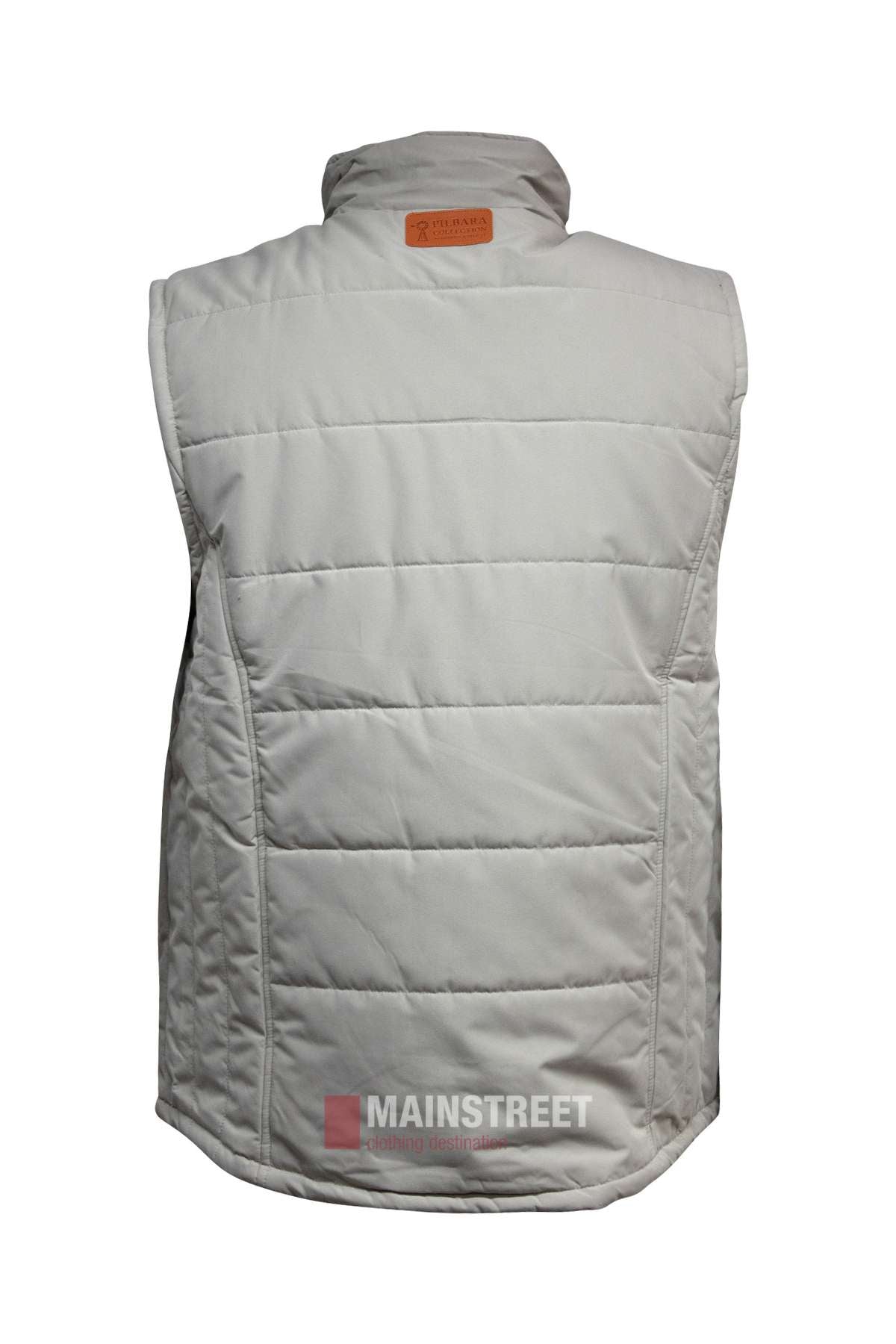 The Pilbara Vest is a light gray, quilted puffer vest with polyfill padding, shown from the back. It features a brown leather patch on the collar and "MAINSTREET" plus clothing instructions watermarked at the bottom.
