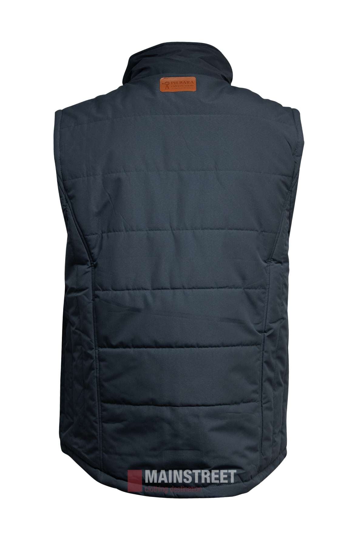 A dark blue Pilbara Vest shown from the back, with horizontal stitching, polyfill padding, and a small brown logo patch near the collar. "MAINSTREET" watermark appears at the bottom of the image.
