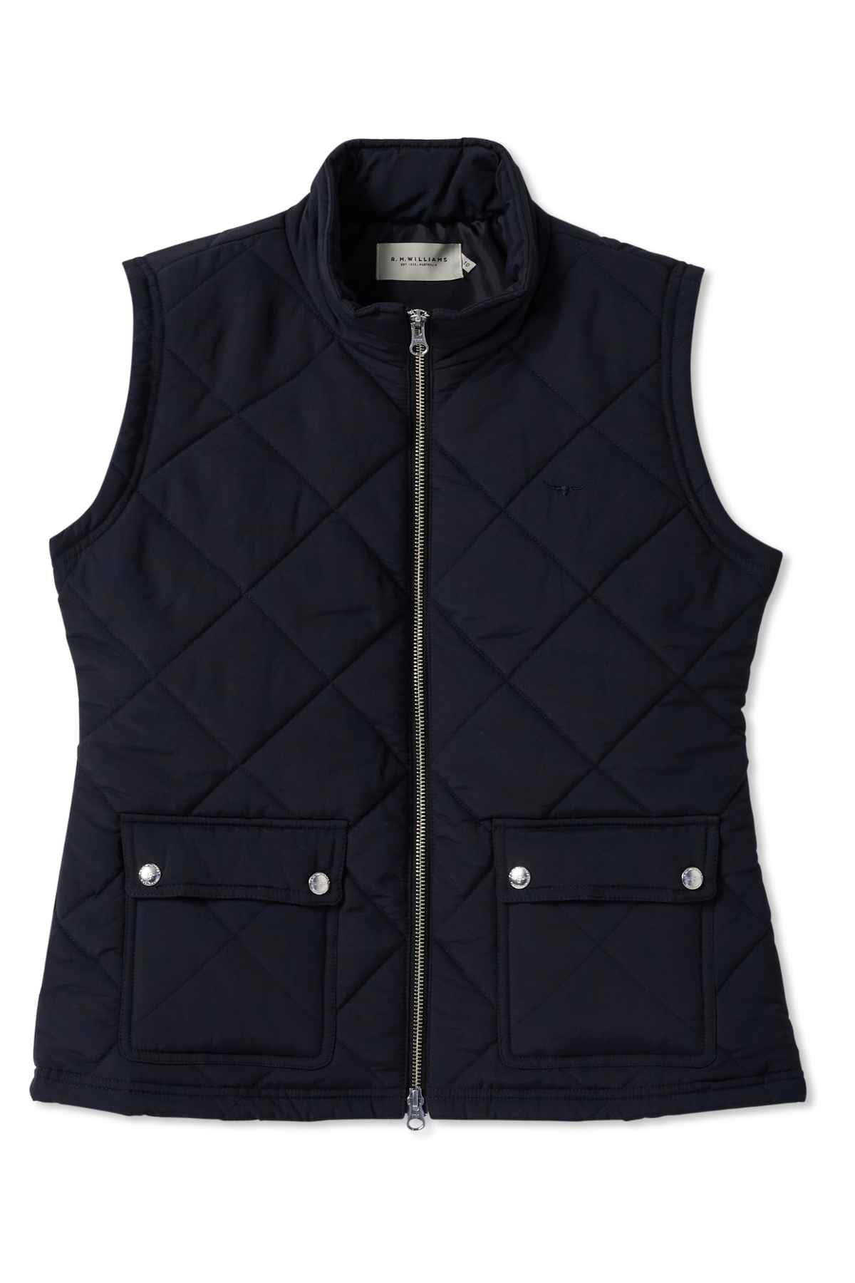 The RM Williams Willippa Vest is a black, quilted, sleeveless piece made from recycled nylon with a front zipper. It features two buttoned pockets, a high collar, and subtle diamond pattern fabric with a visible neck tag.