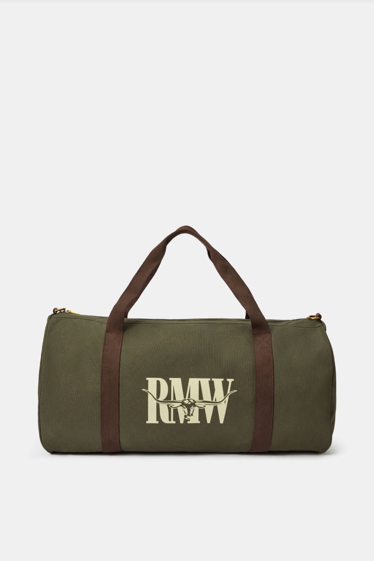 The RM Williams Heritage Bag is an olive green cotton canvas duffel with dark brown handles, shoulder straps, and a large cream "RMW" heritage logo on the front.