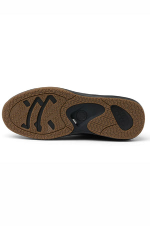 The image shows the brown rubber sole of the Reef Fanning Mens Shoe, with textured grip patterns, circular grooves, cushioned comfort, and a built-in bottle opener—viewed from below against a white background.