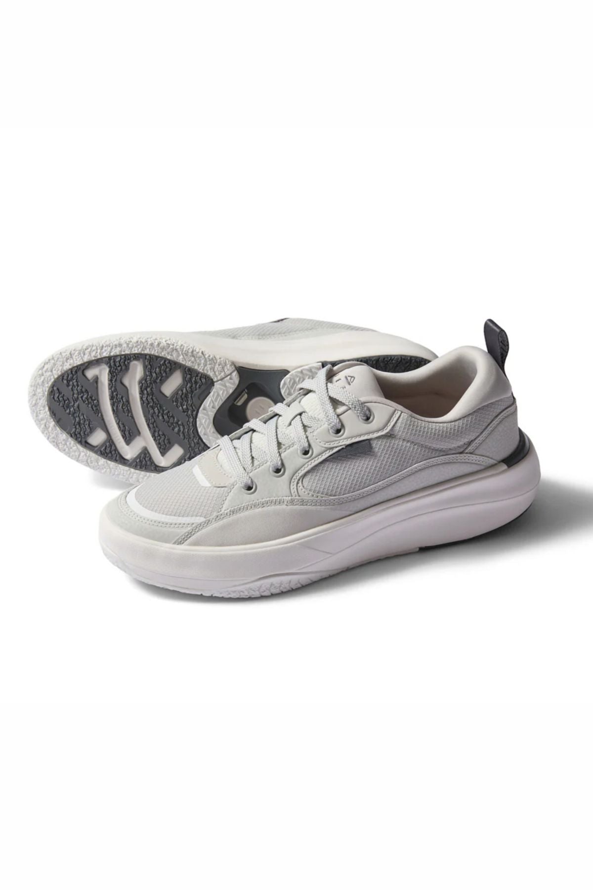 The Reef Fanning Mens Shoe in light gray features white midsoles, gray textured outsoles with a visible sole pattern, and includes a built-in bottle opener. One shoe is upright while the other shows the sole design.