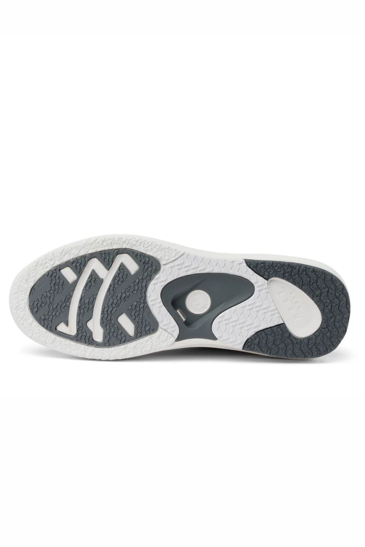 The Reef Fanning Mens Shoe features a white and gray rubber sole with textured, geometric patterns for traction and includes a built-in bottle opener for convenience.