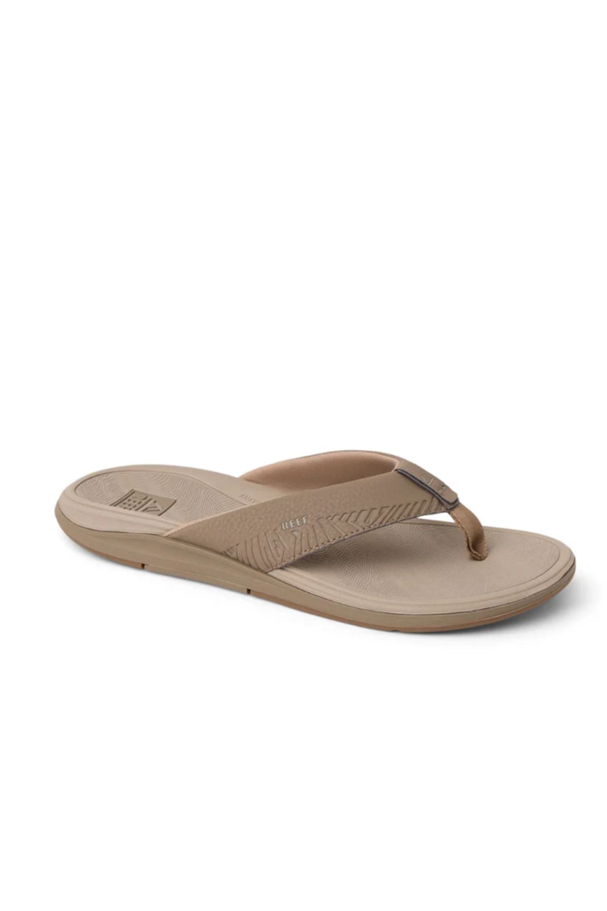 Experience comfort like never before with the REEF Offshore—a tan flip-flop sandal featuring a textured footbed and matching thong strap, crafted for excellent arch support and displayed against a white background.