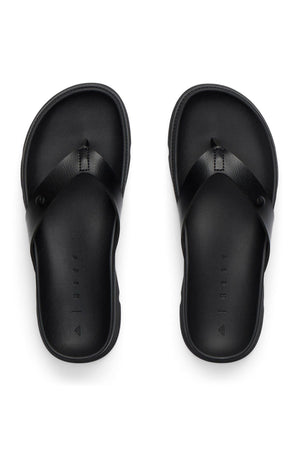 A pair of REEF Vista Luxe Vivianahh black flip-flop sandals with wide straps and ergonomic, contoured cushioned footbeds, shown from above on a white background.