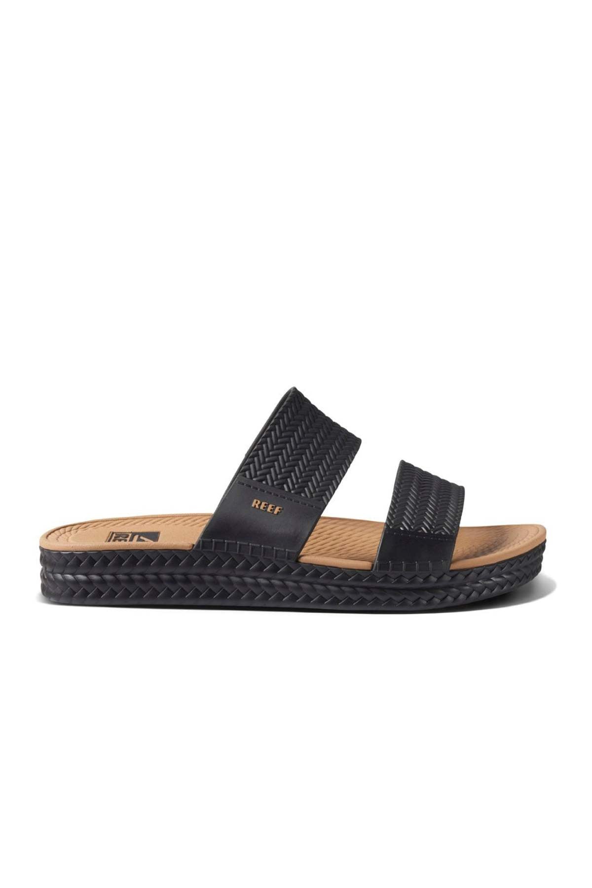 The REEF Water Vista Slide offers a stylish black sandal with two woven straps and a tan dual density EVA footbed for comfort. Its textured black sole adds a casual touch, making this waterproof sandal ideal for warm weather outfits.