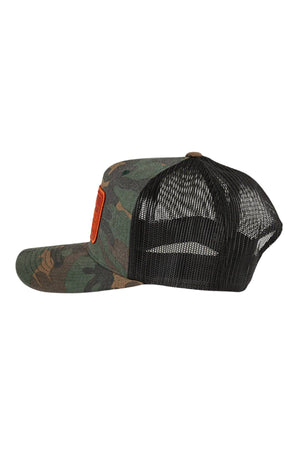 Side view of the Ringers Western Awol Trucker Cap with a green and brown camo front, black mesh back, red front patch, curved brim, and snapback closure.