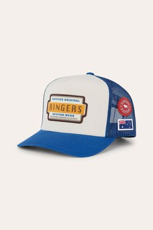 The Ringers Western Drive By Deep Fit Trucker Cap is a blue and white trucker hat featuring a “Ringers Western Wear” patch on the front, a red circular patch, and an Australian flag on the side. It’s designed with a deep fit for comfort and provides excellent sun protection.