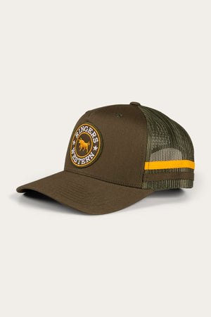 The Ringers Western McCoy Trucker Cap is a green baseball cap featuring a mesh back and an embroidered patch on the front, showcasing a yellow bull and the text "Ringers Western." Made from cotton twill, it also includes a distinctive yellow stripe across the mesh panel.