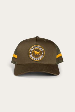 The Ringers Western McCoy Trucker Cap, made from olive green cotton twill, is adorned with yellow side stripes and a mesh back. Its front has a round patch featuring a yellow border, a yellow bull silhouette, and the text "RINGERS WESTERN" in yellow.