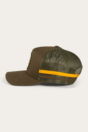 The Ringers Western McCoy Trucker Cap features an olive green cotton twill front with a brown bill and a structured panel, along with a mesh back highlighted by a yellow horizontal stripe running across the middle.