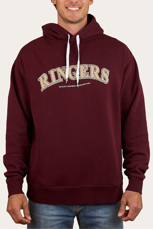 Someone wears a maroon Ringers Western Princeton Hoodie with white drawstrings, featuring bold "RINGERS" text across the chest and smaller letters below, styled in an oversized fit with blue jeans.